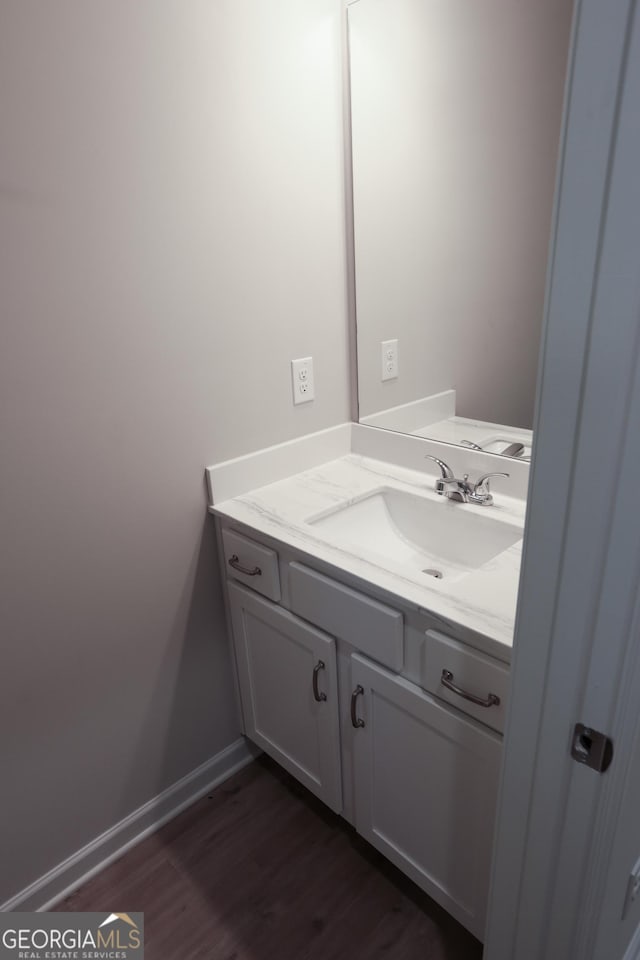 113 Sharp St, Bremen, GA 30110 - bathroom featuring vanity, wood finished floors, and baseboards