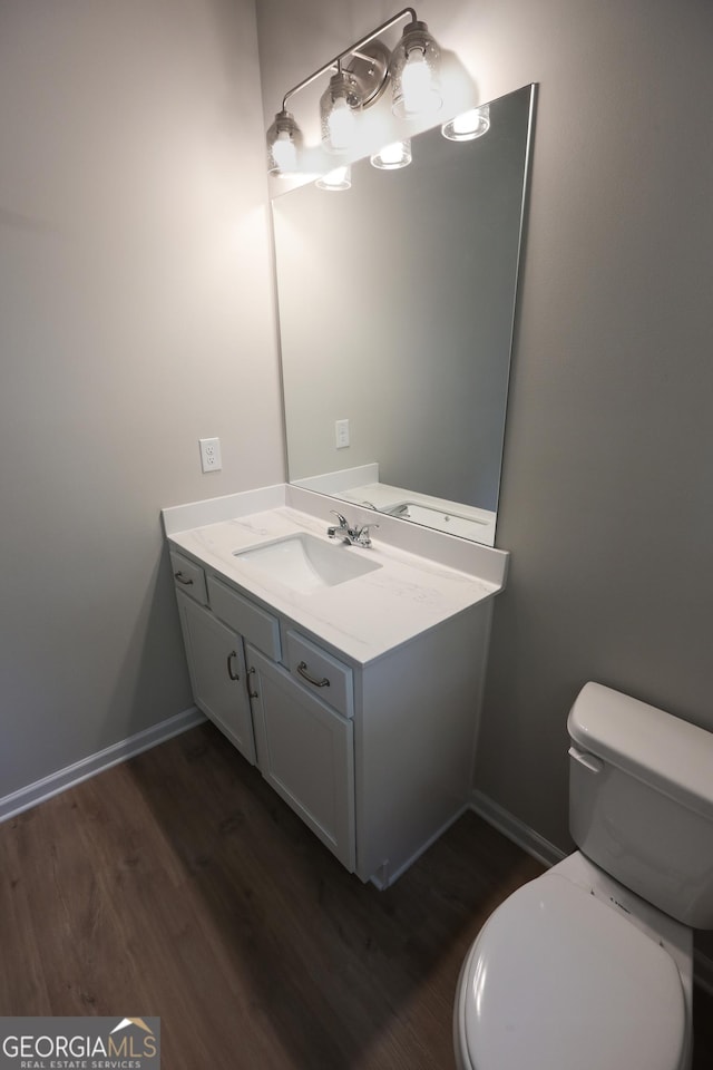 113 Sharp St, Bremen, GA 30110 - bathroom featuring vanity, wood finished floors, toilet, and baseboards