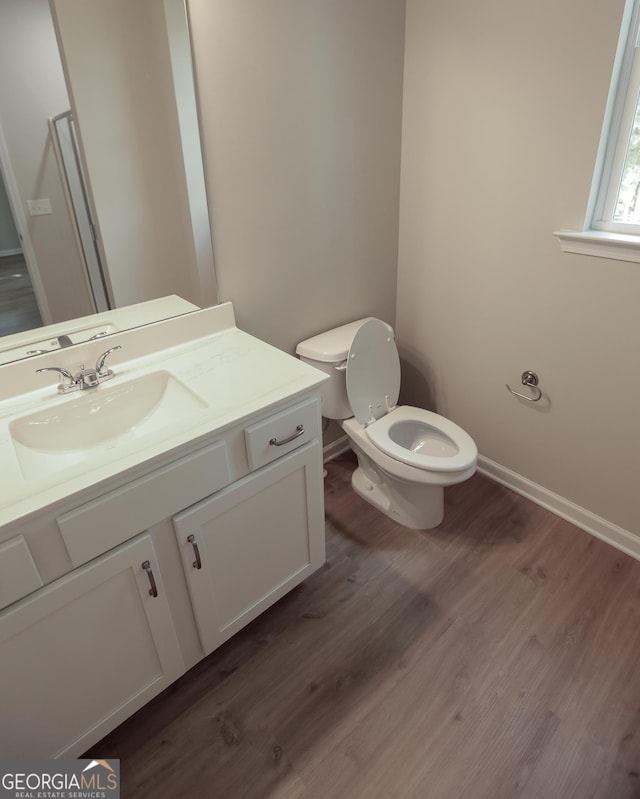 113 Sharp St, Bremen, GA 30110 - bathroom with vanity, wood finished floors, toilet, and baseboards