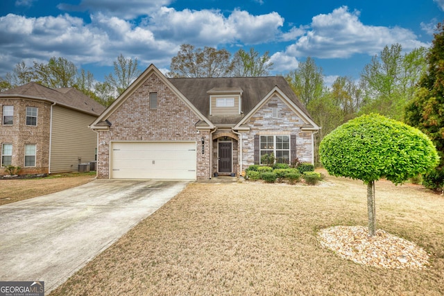 164 Madison Grace Ave, Mcdonough, GA 30252 - traditional home featuring central AC, a garage, a front lawn, and concrete driveway