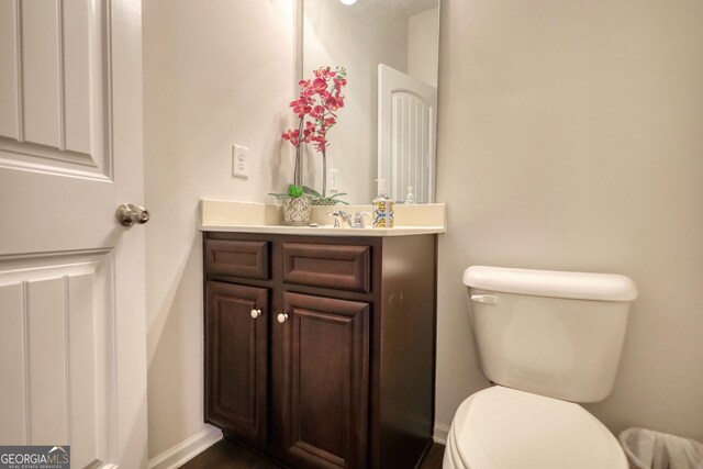 164 Madison Grace Ave, Mcdonough, GA 30252 - half bathroom with toilet, vanity, and baseboards