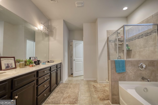 164 Madison Grace Ave, Mcdonough, GA 30252 - bathroom with a tub, baseboards, visible vents, double vanity, and tiled shower