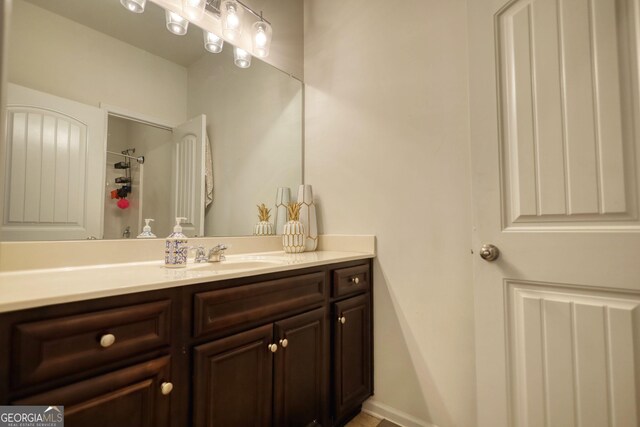 164 Madison Grace Ave, Mcdonough, GA 30252 - bathroom with baseboards, walk in shower, and vanity