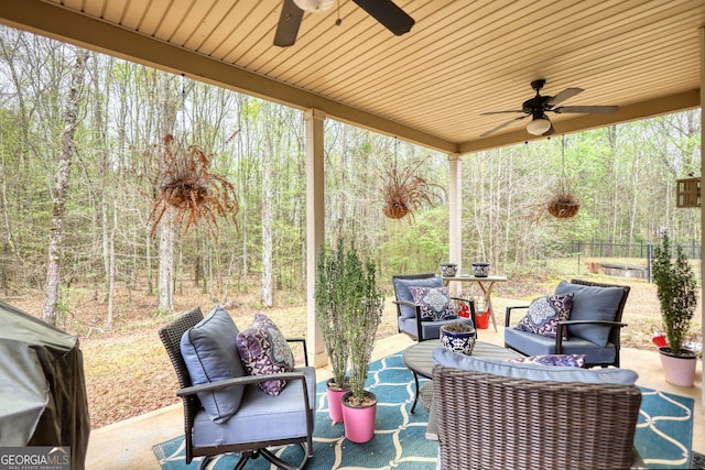 164 Madison Grace Ave, Mcdonough, GA 30252 - view of patio with outdoor lounge area, ceiling fan, fence, and a forest view