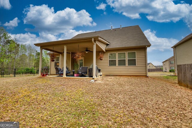 164 Madison Grace Ave, Mcdonough, GA 30252 - rear view of house featuring a ceiling fan, fence, and a patio area