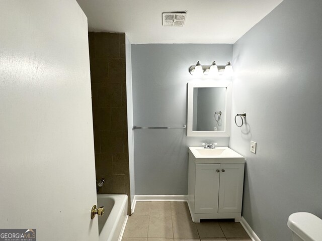 2087 John Wesley Ct, Decatur, GA 30035 - full bathroom featuring toilet, vanity, tile patterned flooring, baseboards, and visible vents