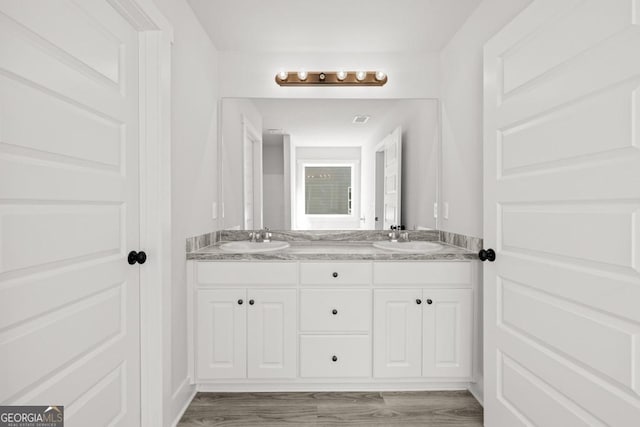 357 Liberty Hill Rd Unit 18, Hartwell, GA 30643 - bathroom featuring double vanity, a sink, and wood finished floors