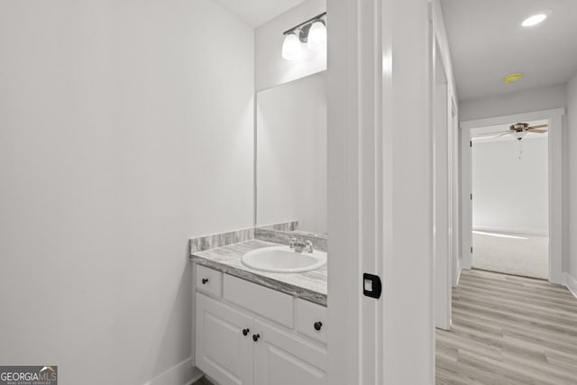 357 Liberty Hill Rd Unit 18, Hartwell, GA 30643 - bathroom with baseboards, wood finished floors, recessed lighting, and vanity