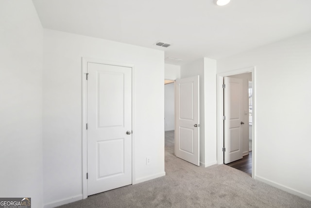 330 White Tail Rd, Stockbridge, GA 30253 - unfurnished bedroom featuring baseboards, visible vents, and carpet flooring