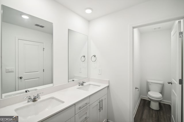 330 White Tail Rd, Stockbridge, GA 30253 - full bathroom featuring double vanity, a sink, toilet, and visible vents