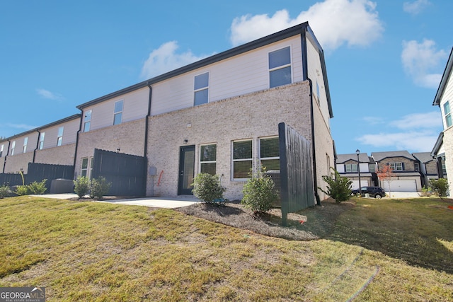 330 White Tail Rd, Stockbridge, GA 30253 - back of house featuring a garage, fence, concrete driveway, and a yard