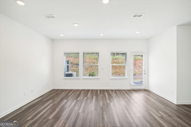 330 White Tail Rd, Stockbridge, GA 30253 - empty room featuring dark wood-style floors, visible vents, baseboards, and recessed lighting