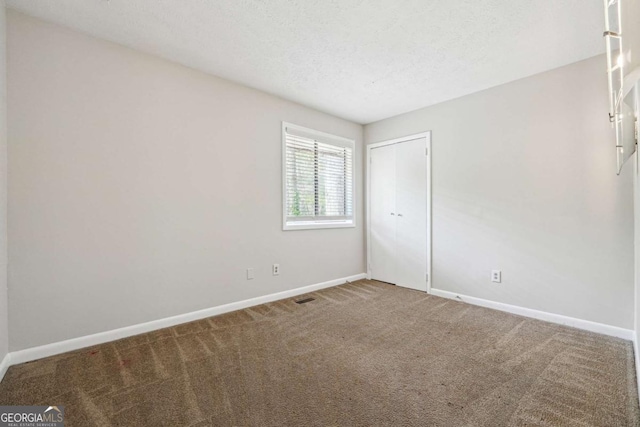 1360 Cypress Ridge Cir, Stone Mountain, GA 30083 - empty room featuring baseboards, visible vents, carpet floors, and a textured ceiling