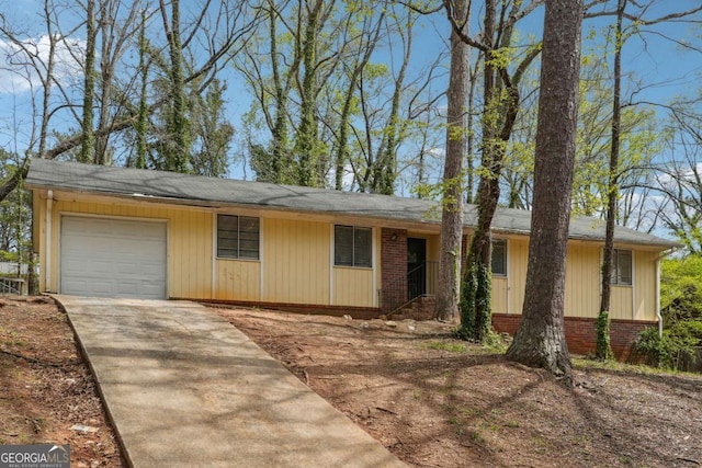 1360 Cypress Ridge Cir, Stone Mountain, GA 30083 - ranch-style home featuring brick siding, a garage, and concrete driveway
