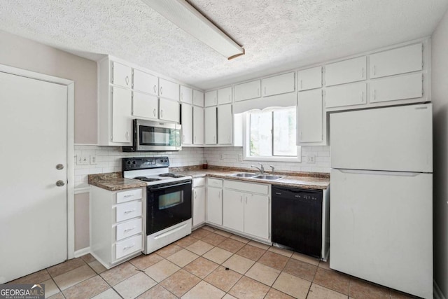 1360 Cypress Ridge Cir, Stone Mountain, GA 30083 - kitchen with range with electric cooktop, a sink, freestanding refrigerator, stainless steel microwave, and black dishwasher