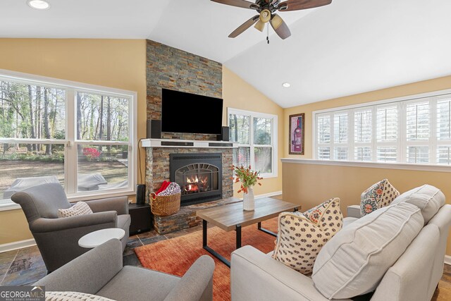 living area featuring recessed lighting, lofted ceiling, a fireplace, and ceiling fan