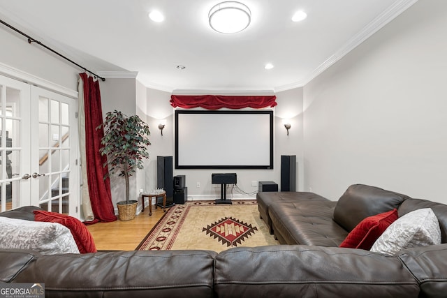 cinema with ornamental molding, wood finished floors, french doors, and recessed lighting