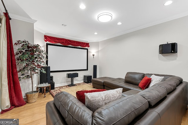 home theater featuring recessed lighting, crown molding, and wood finished floors