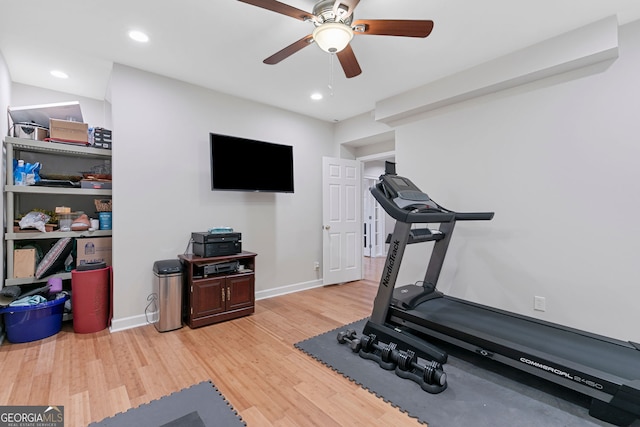 exercise room with baseboards, a ceiling fan, recessed lighting, and light wood-type flooring