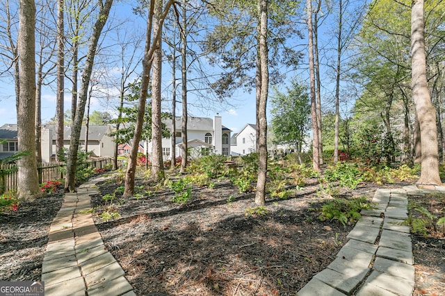 view of yard featuring a residential view and fence