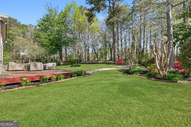 view of yard with a deck
