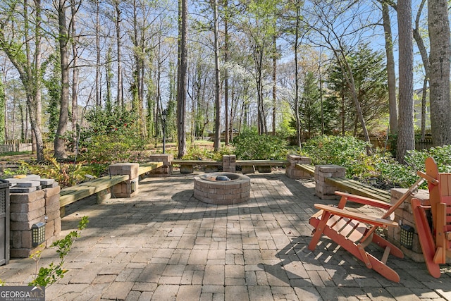 view of patio / terrace with a fire pit