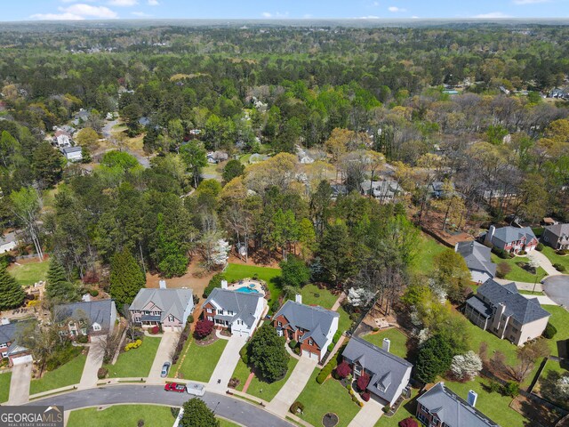drone / aerial view with a residential view and a forest view