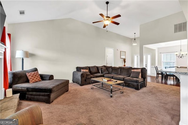 95 Summerlyn Dr, Hiram, GA 30141 - living area featuring a ceiling fan, carpet flooring, lofted ceiling, and a chandelier