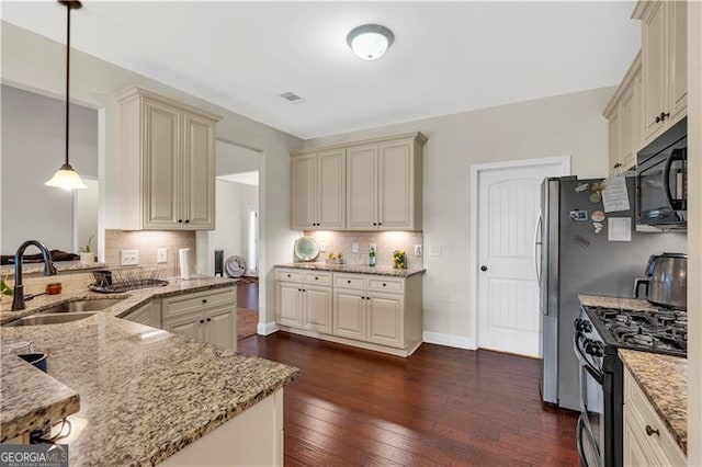 95 Summerlyn Dr, Hiram, GA 30141 - kitchen with a sink, cream cabinets, stainless steel gas stove, black microwave, and light stone countertops