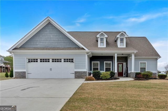 95 Summerlyn Dr, Hiram, GA 30141 - craftsman-style house featuring stone siding, a front yard, a garage, driveway, and a shingled roof