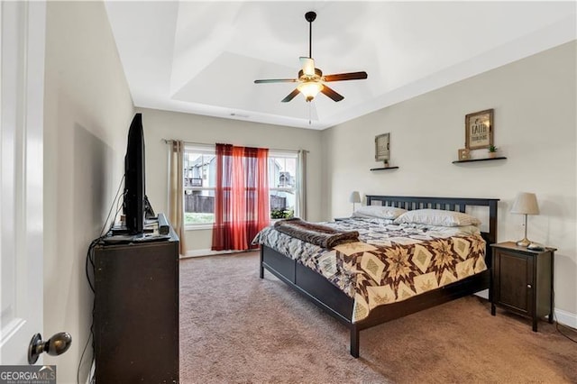 95 Summerlyn Dr, Hiram, GA 30141 - carpeted bedroom featuring a raised ceiling, baseboards, and a ceiling fan