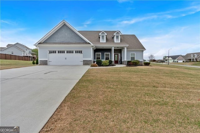 95 Summerlyn Dr, Hiram, GA 30141 - craftsman-style house featuring a garage, driveway, a front lawn, and stone siding