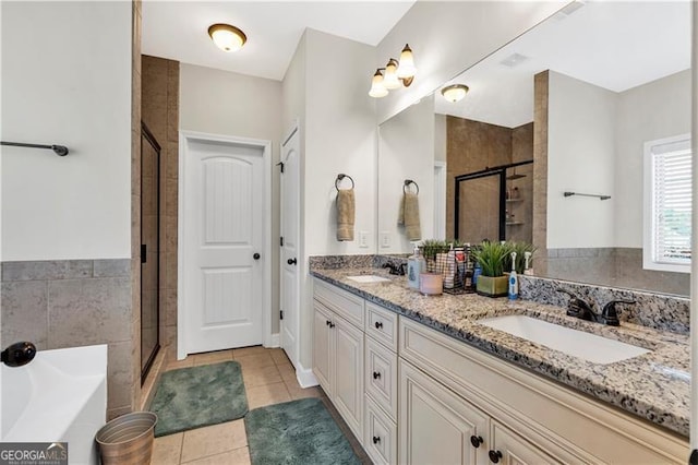 95 Summerlyn Dr, Hiram, GA 30141 - full bath with a shower stall, double vanity, a garden tub, and tile patterned flooring