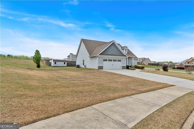 95 Summerlyn Dr, Hiram, GA 30141 - view of property exterior featuring driveway, an attached garage, a lawn, and central air condition unit