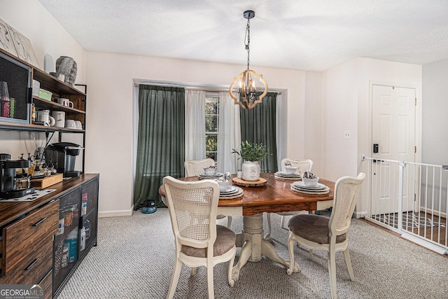 dining area featuring an inviting chandelier, light carpet, baseboards, and a textured ceiling