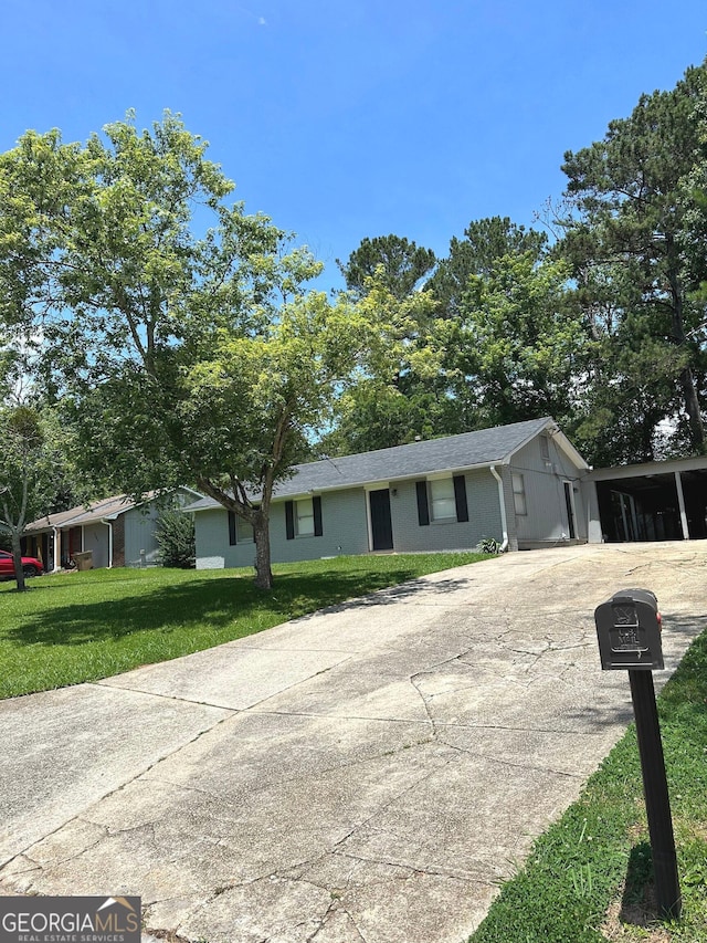 2900 Haddon Dr, Rex, GA 30273 - ranch-style house with concrete driveway and a front lawn
