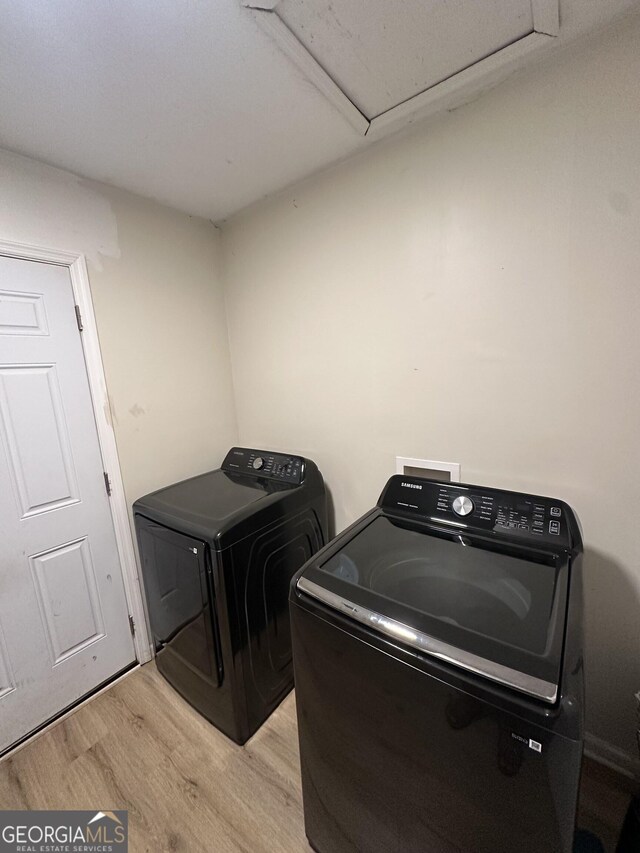 2900 Haddon Dr, Rex, GA 30273 - washroom featuring washer and clothes dryer and light wood-type flooring
