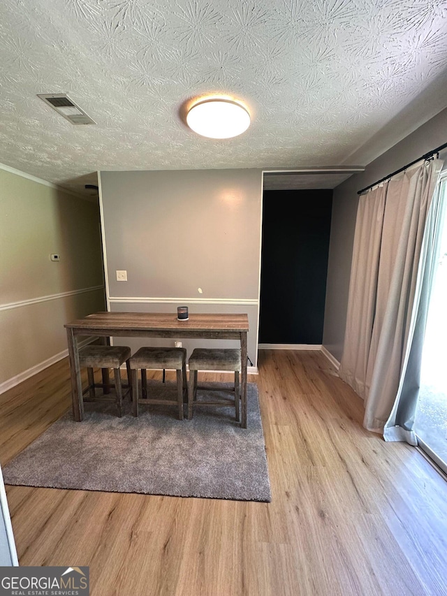 2900 Haddon Dr, Rex, GA 30273 - dining space featuring wood finished floors and a textured ceiling