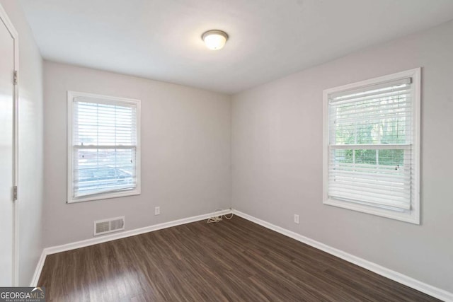 121 Hillsdale Dr SE, Atlanta, GA 30315 - empty room featuring dark wood-style flooring and baseboards