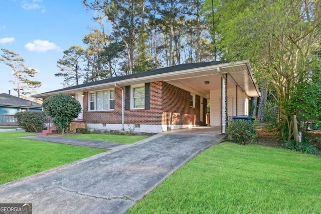 121 Hillsdale Dr SE, Atlanta, GA 30315 - single story home featuring asphalt driveway, brick siding, a front yard, and a carport