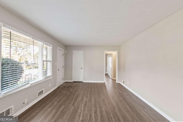 121 Hillsdale Dr SE, Atlanta, GA 30315 - unfurnished living room with dark wood-style floors and baseboards
