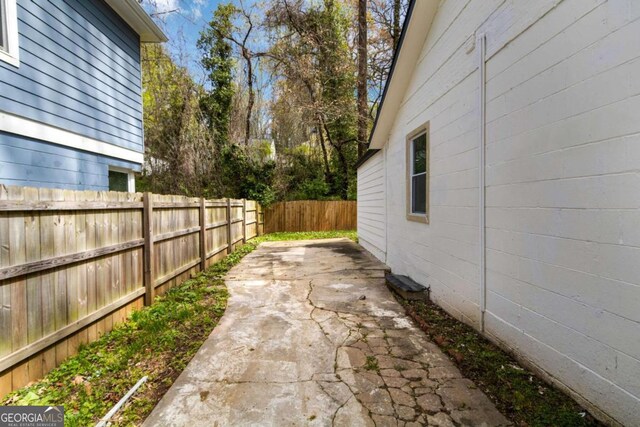 1318 Graymont Dr SW, Atlanta, GA 30310 - view of yard featuring a fenced backyard and a patio