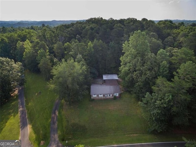 bird's eye view featuring a forest view