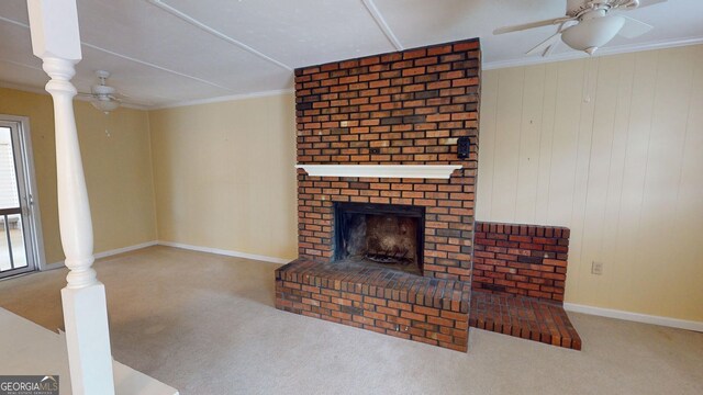 unfurnished living room featuring baseboards, a ceiling fan, carpet, and a brick fireplace