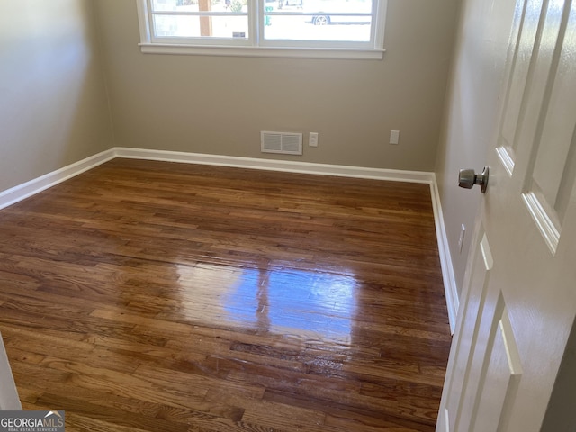 2502 Miriam Ln, Decatur, GA 30032 - unfurnished room with healthy amount of natural light, dark wood-type flooring, and baseboards