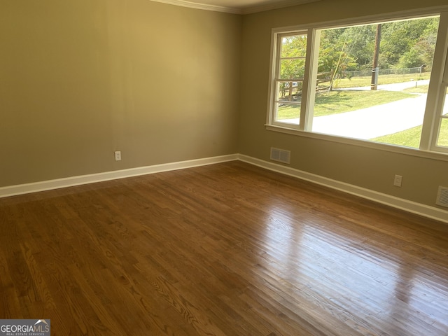 2502 Miriam Ln, Decatur, GA 30032 - spare room featuring ornamental molding, baseboards, and dark wood-style floors