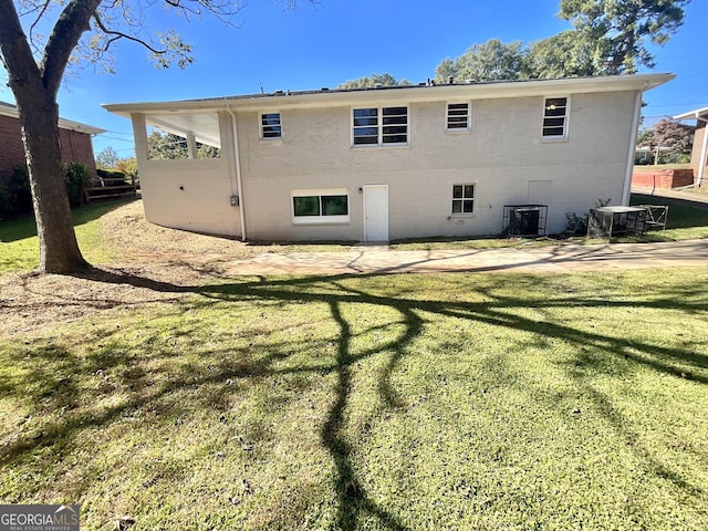 2502 Miriam Ln, Decatur, GA 30032 - rear view of house featuring a lawn, a patio area, and central AC