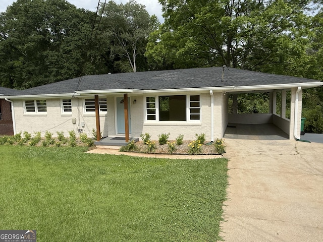 2502 Miriam Ln, Decatur, GA 30032 - view of front of house featuring concrete driveway, a front yard, a carport, and a shingled roof