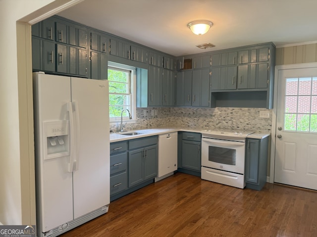 2502 Miriam Ln, Decatur, GA 30032 - kitchen with white appliances, a sink, healthy amount of natural light, and light countertops