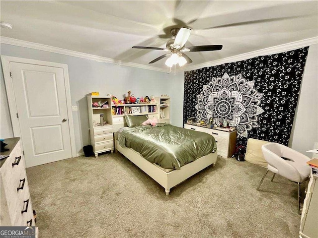 bedroom with carpet floors, ornamental molding, and ceiling fan